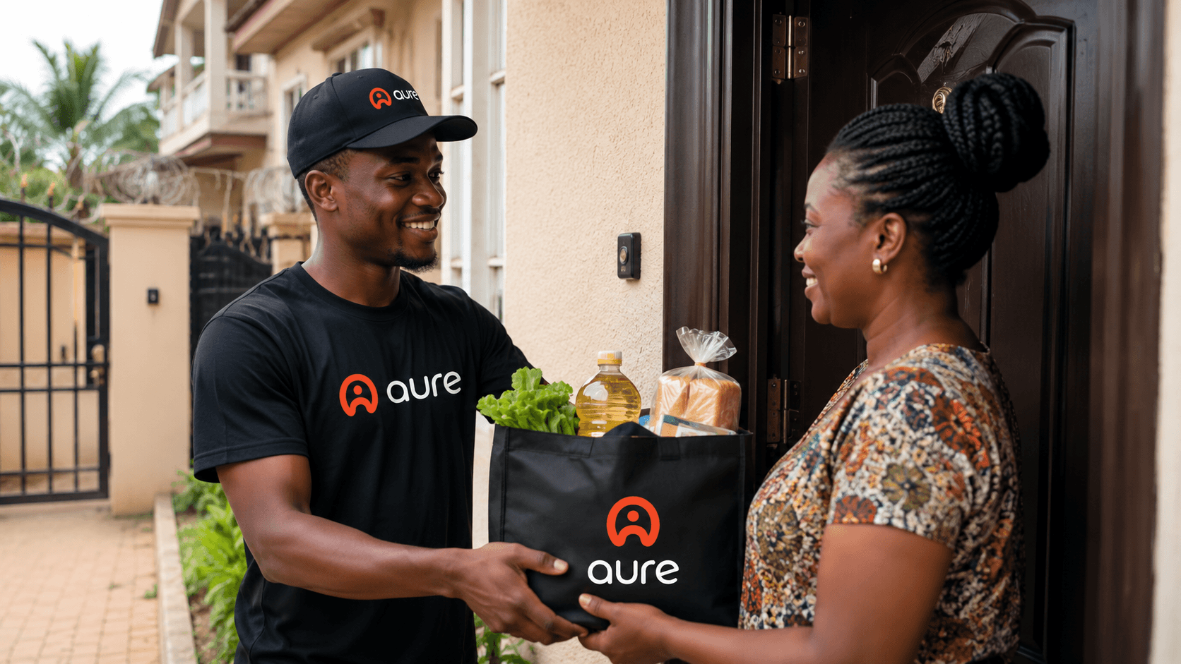 A Helper handing groceries to a Member at their front door